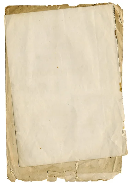 Um papel antigo áspero com bordas rasgadas — Fotografia de Stock