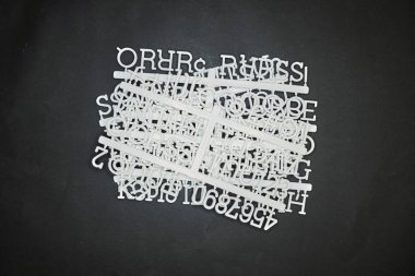 A studio photo of a letter board letters