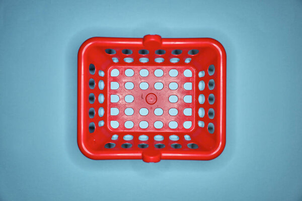 A studio photo of a shopping basket