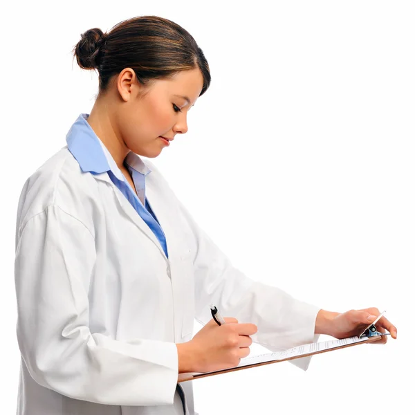 Medical doctor writing on clipboard — Stock Photo, Image