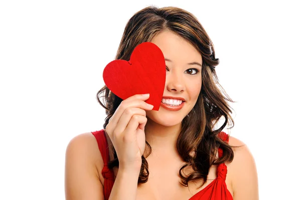 Young woman hides behind heart — Stock Photo, Image
