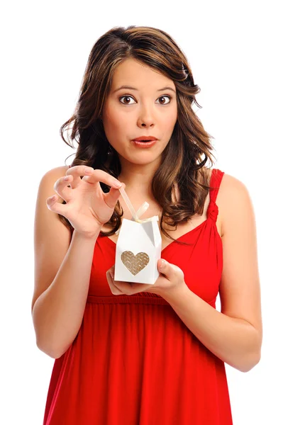 Young woman opening a present — Stock Photo, Image