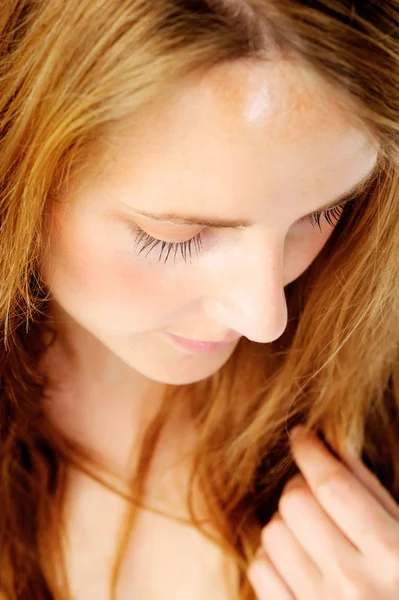 Demure redhead looking down — Stock Photo, Image