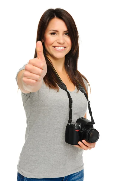 Mooie vrouw duimen omhoog met camera — Stockfoto