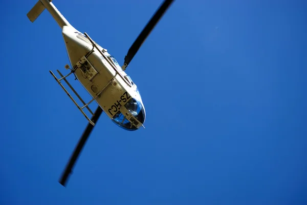 Front view of helicopter in flight. Fly over the snow mountain. — Stock Photo, Image