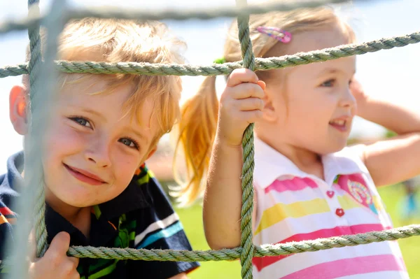 Siblings playing — Stock Photo, Image