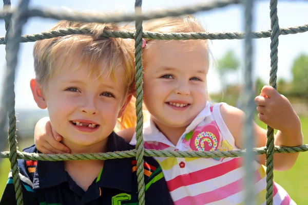 Siblings playing — Stock Photo, Image