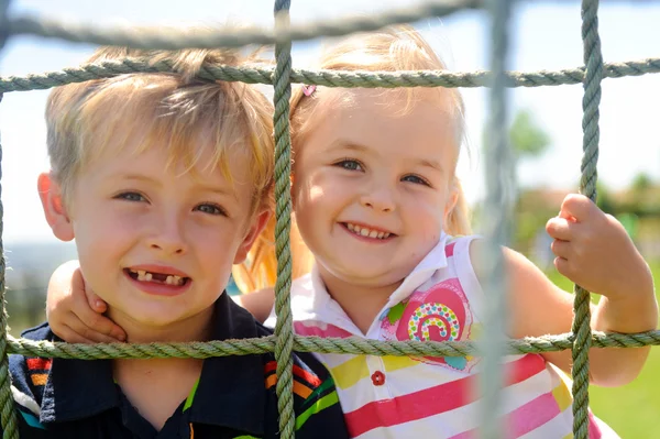 Siblings playing — Stock Photo, Image