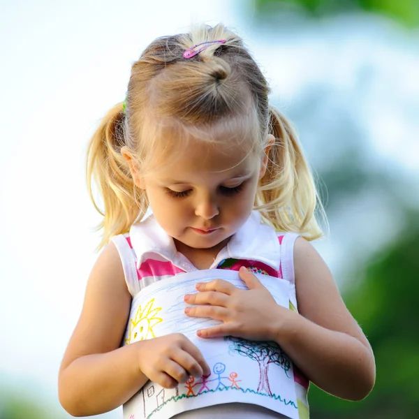 Child holding drawing — Stock Photo, Image