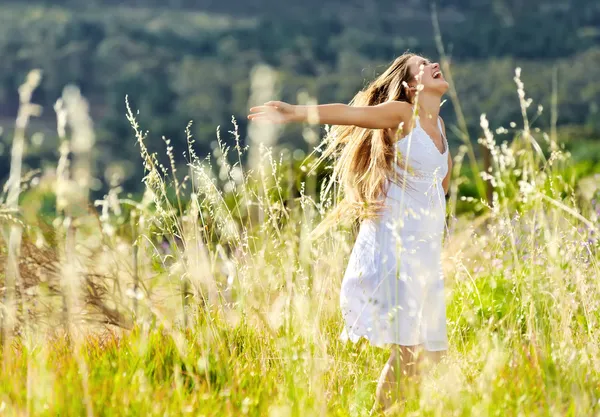 Sunset dancing meadow girl Stock Photo