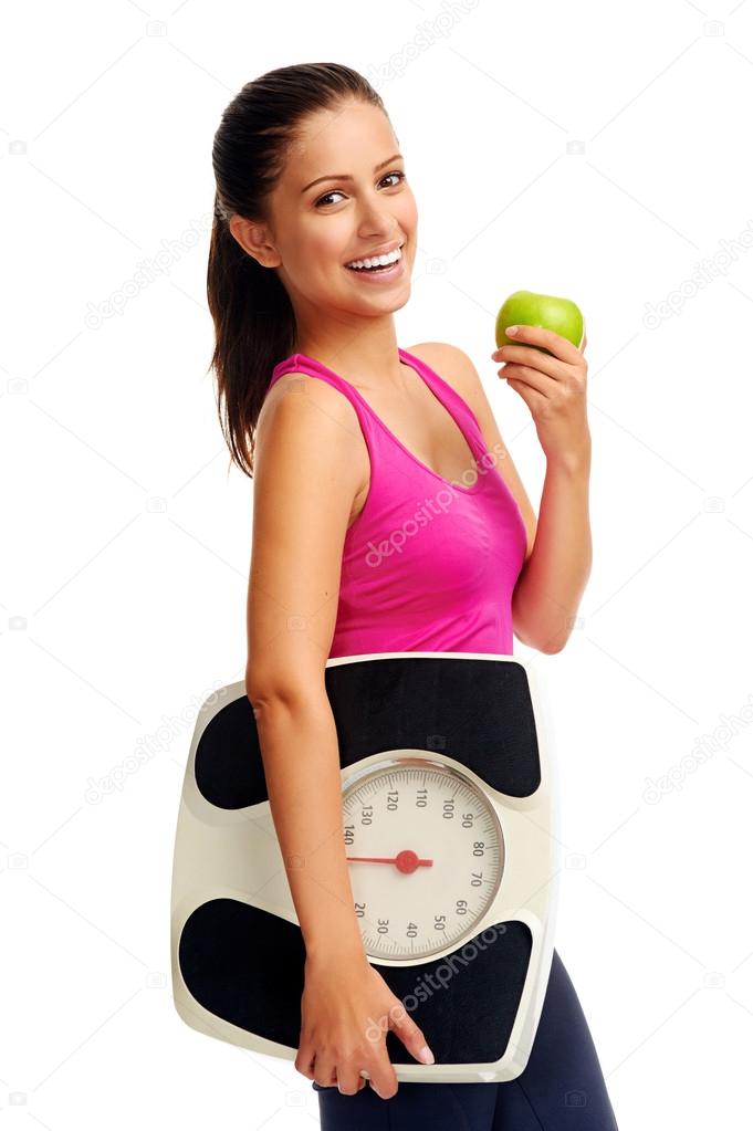Woman with an apple and weightloss