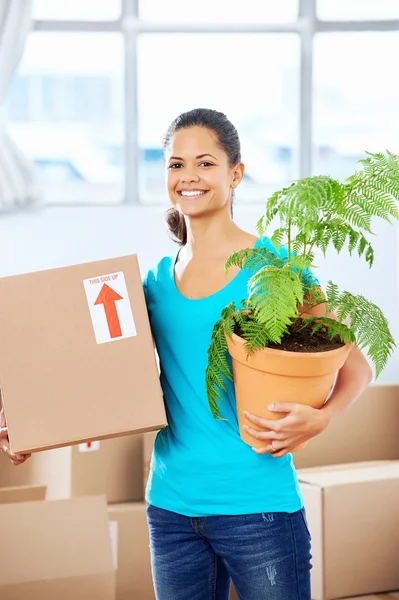 Girl moving in box — Stock Photo, Image