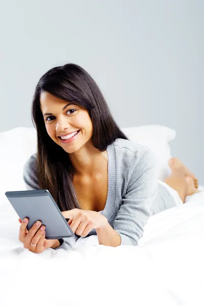 Tablet reading woman Stock Image