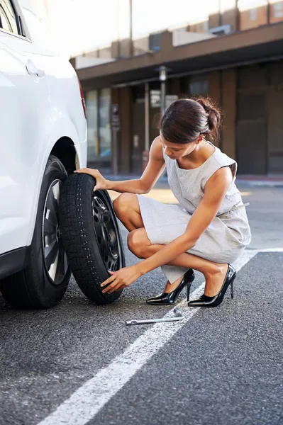 Flat tire woman Stock Picture