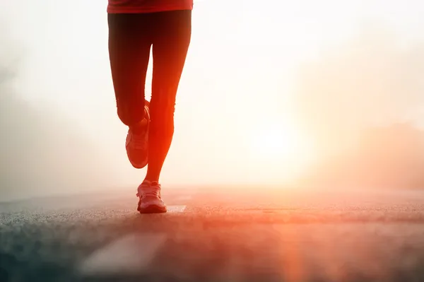 Athlete running road silhouette Stock Image