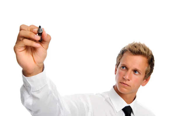 Smiling young businessman holds pen — Stock Photo, Image