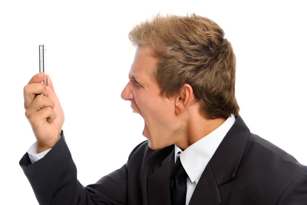 Young man holding his cellphone against a white background — Stock Photo, Image