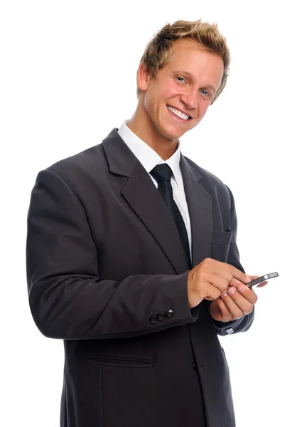 Giovane uomo che tiene il cellulare su uno sfondo bianco — Foto Stock