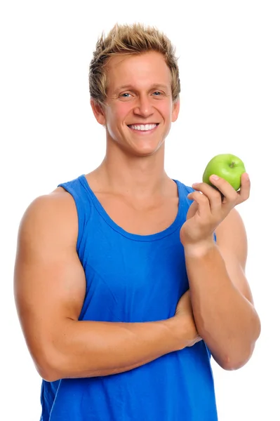 Спортивный человек с яблоком — стоковое фото