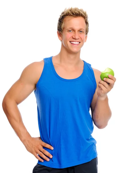 Sportig man med äpple — Stockfoto