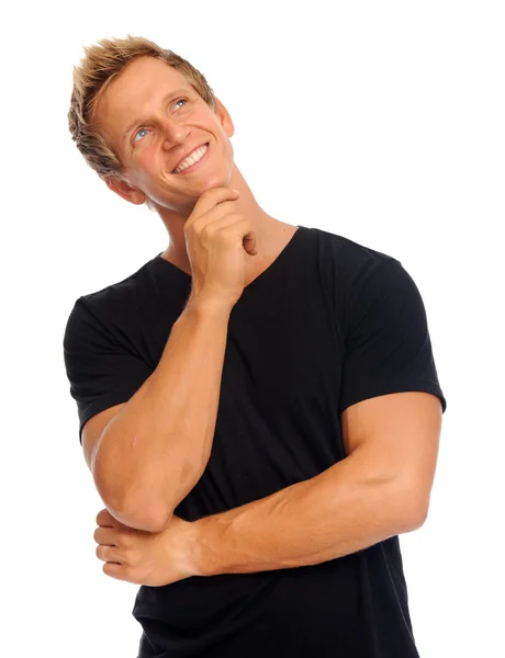 Attractive man imagines happily Stock Picture