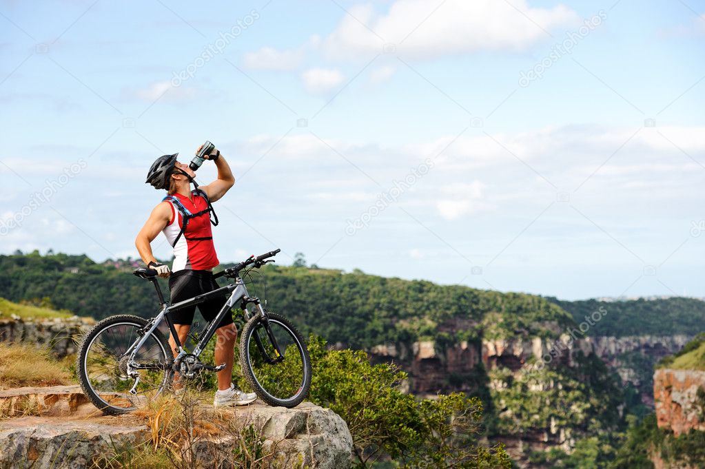 man drinks after cycle