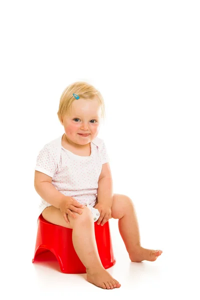 Toddler girl potty trainting isolated on white — Stock Photo, Image