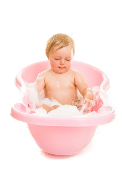 Cute infant girl in bath isolated on white — Stock Photo, Image