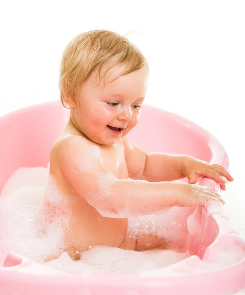 Cute infant girl in bath isolated on white — Stock Photo, Image