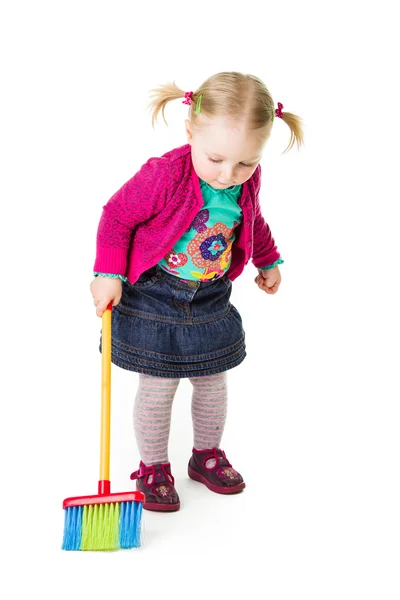 : Infant girl child with a broom — Stock Photo, Image