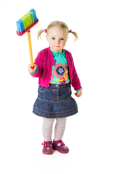 : Infant girl child with a broom — Stock Photo, Image