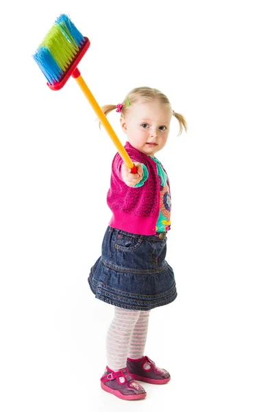 : Infant girl child with a broom — Stock Photo, Image