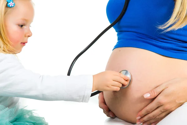 Pregnant woman with 2 yo daughter on white — Stock Photo, Image