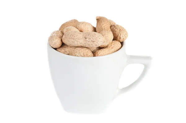 Amendoins em uma xícara branca — Fotografia de Stock