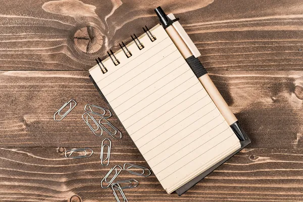 Open blank notebook with paper clips — Stock Photo, Image