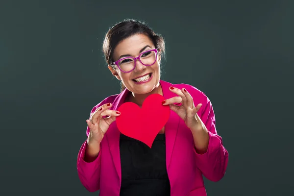 Funny woman holding a heart — Stock Photo, Image