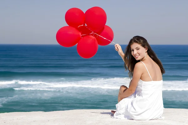 Ragazza con palloncini rossi — Foto Stock