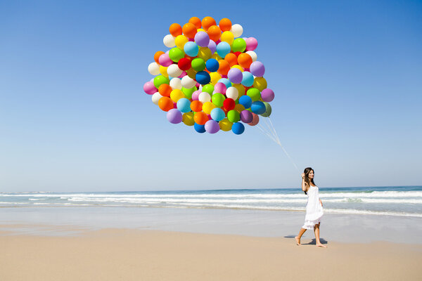 Beauty walking with ballons