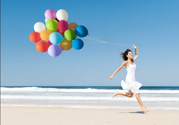 Uitgevoerd en springen met ballons — Stockfoto