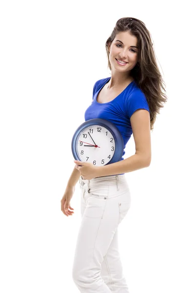 Beautiful woman with a clock Stock Picture
