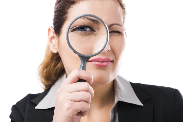 Business holding a magnifying glass — Stock Photo, Image