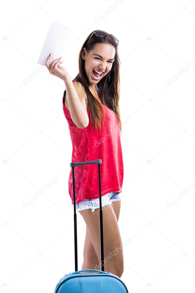 Happy woman holding a flight ticket