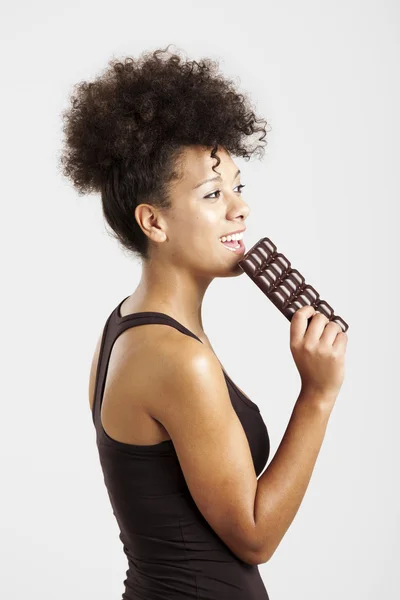 Woman eating chcolate — Stock Photo, Image