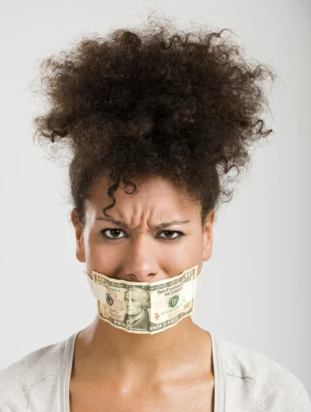 Covering mouth with a dollar banknote — Stock Photo, Image