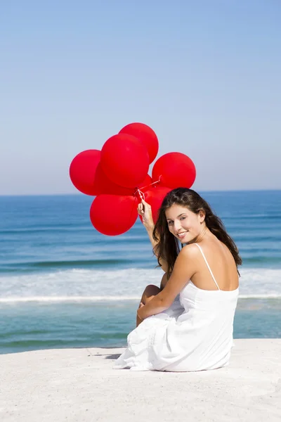 Ragazza con palloncini rossi — Foto Stock