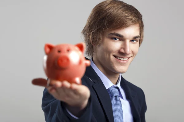 Holding a piggy bank — Stock Photo, Image