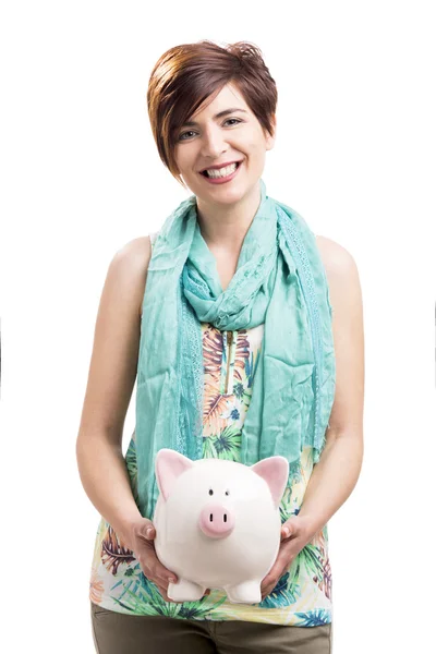 Happy woman with a piggy bank — Stock Photo, Image