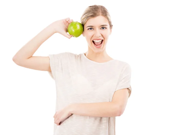 Szép nő, egy zöld almával — Stock Fotó