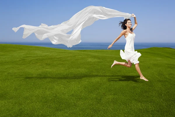 Jumping with a white tissue — Stock Photo, Image