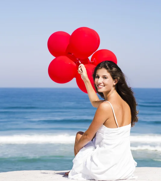 Ragazza con palloncini rossi — Foto Stock